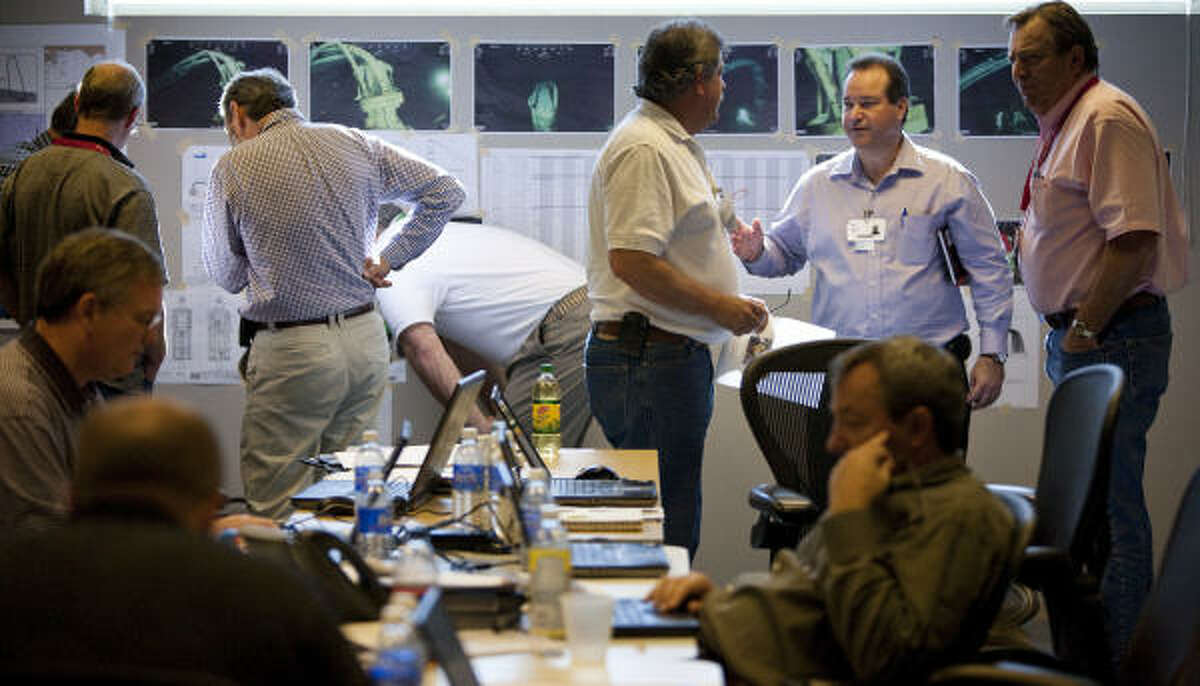 Technical experts crowd a conference room at BP offices in Houston. The energy company has established a crisis center at their west Houston campus where company officials say a global response of experts in oil drilling are working around the clock to figure out how to stop oil into leaking the Gulf of Mexico from the Deepwater Horizon incident.