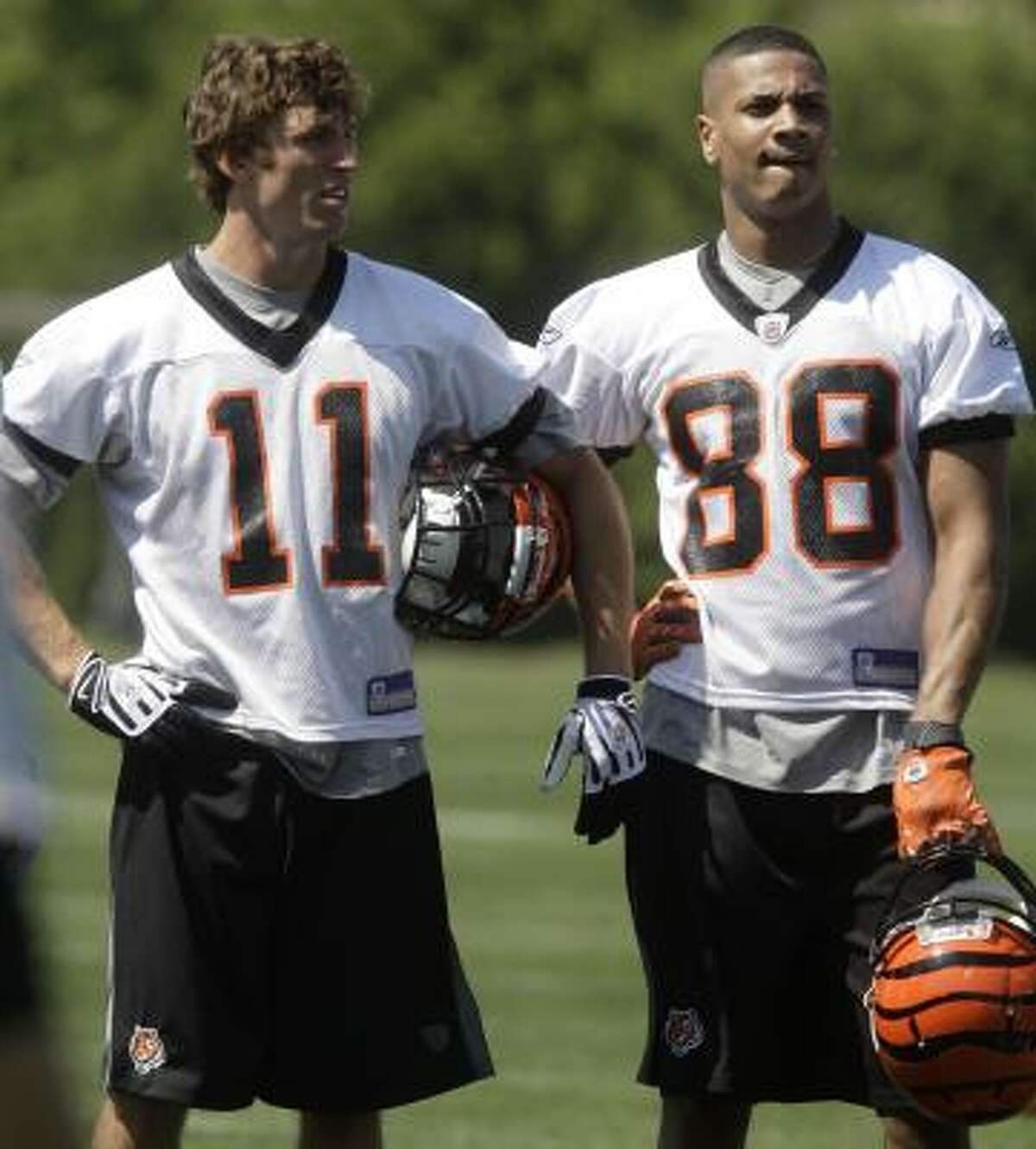 Cincinnati Bengals receivers Jordan Shipley (11) and Dezmon Briscoe take in Friday's minicamp. Shipley, who played for Texas, was drafted in the third round.