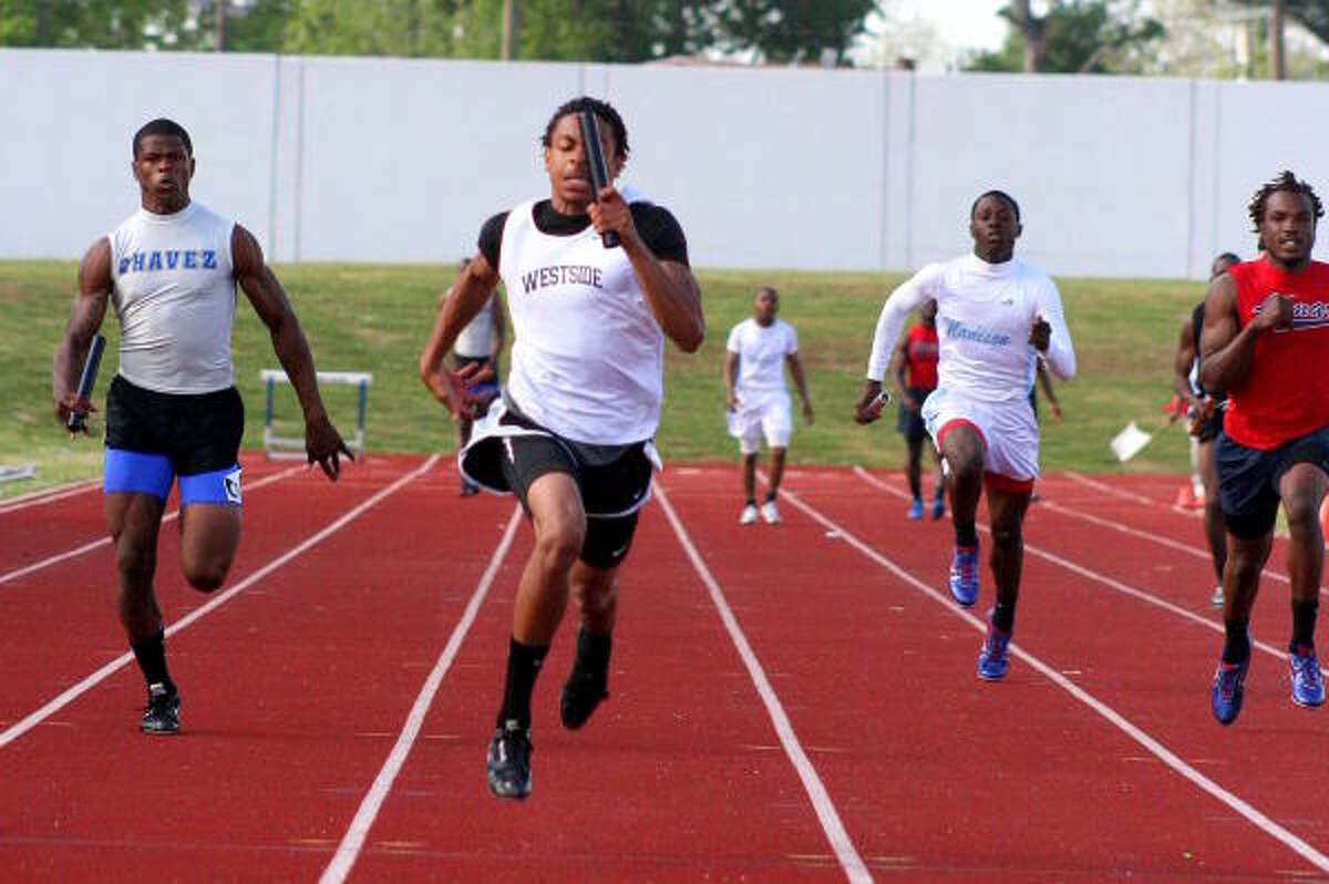 Westside's Bernard Jefferson leads all to the tape in the 400-meter relay.