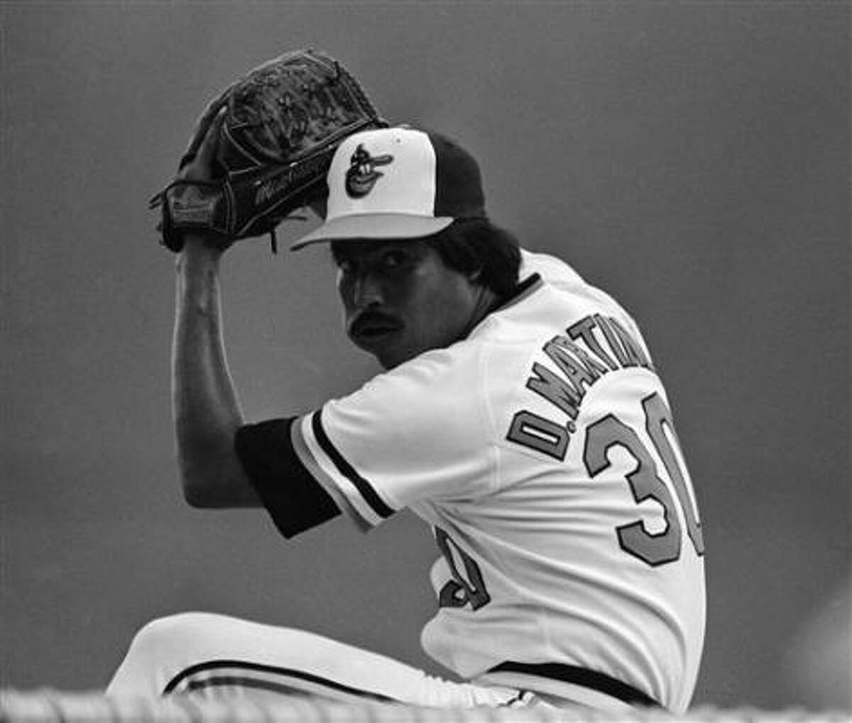 Pitcher Dennis Martinez could still deal with tobacco in his cheek.