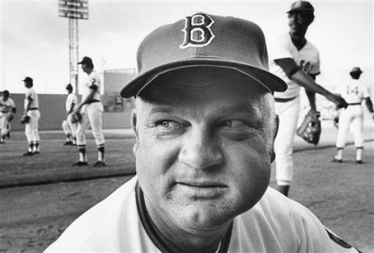 Don Zimmer, a former player and Boston Red Sox manager is photographed with a big wad in his left cheek.