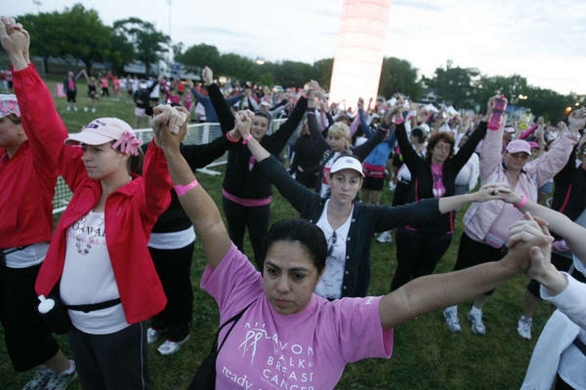 Sylvia Amesquite, 41, of Bay City, weeps as she remembers her mother being a second time breast cancer survivor. She attends the ceremony at Stude Park that kicks off the Avon Walk walking marathon which participants will complete in two days on Saturday, April 10, 2010, in Houston. $2 Million was raised by over 1,000 houston area paticipants.