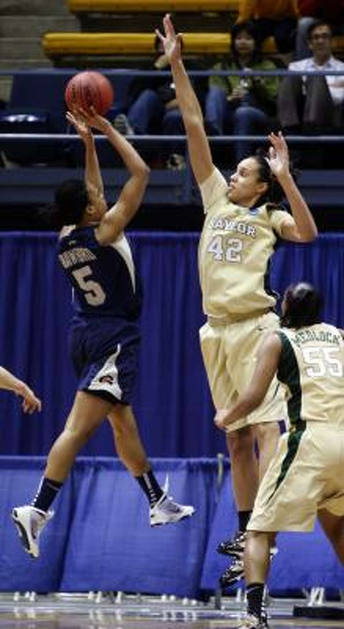 Brittney Griner reaches to block the shot of Georgetown's Adria Crawford. Griner's 14 blocks against Georgetown set a new NCAA Tournament record.