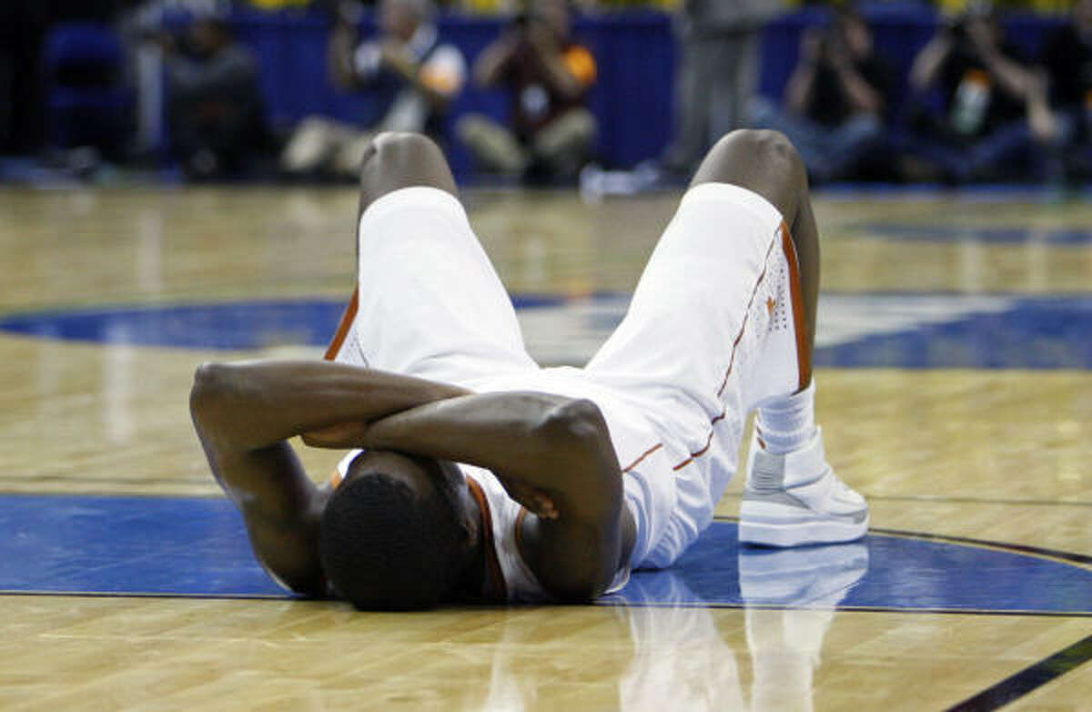 Texas guard Varez Ward lies on the court after losing to Wake Forest 81-80.