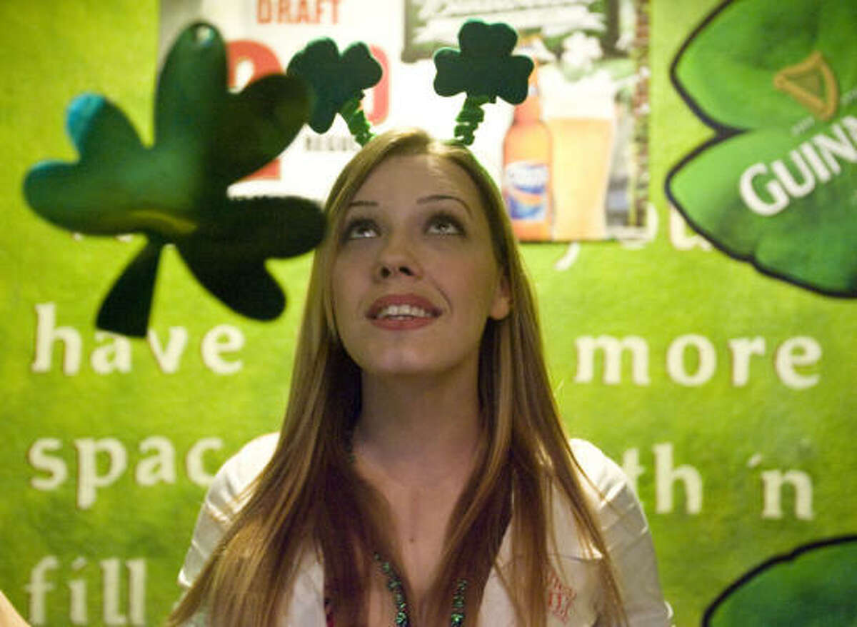 Tilted Kilt Pub & Eatery, manager Danielle Miller decorates the walls of the bar with shamrocks. Take a look at how some folks celebrated.