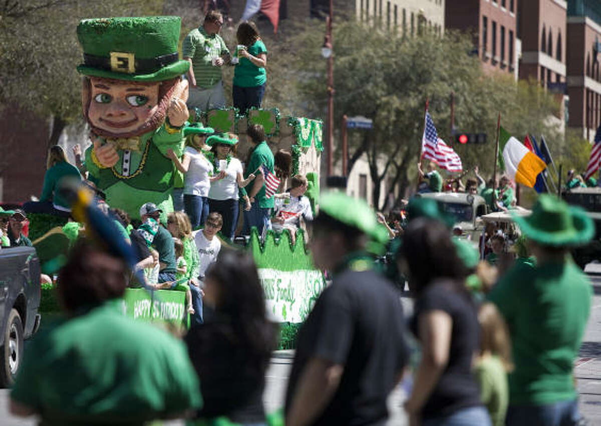 Fans wave to the Kearns family float during the 51st Annual St. Patrick's Day Parade.