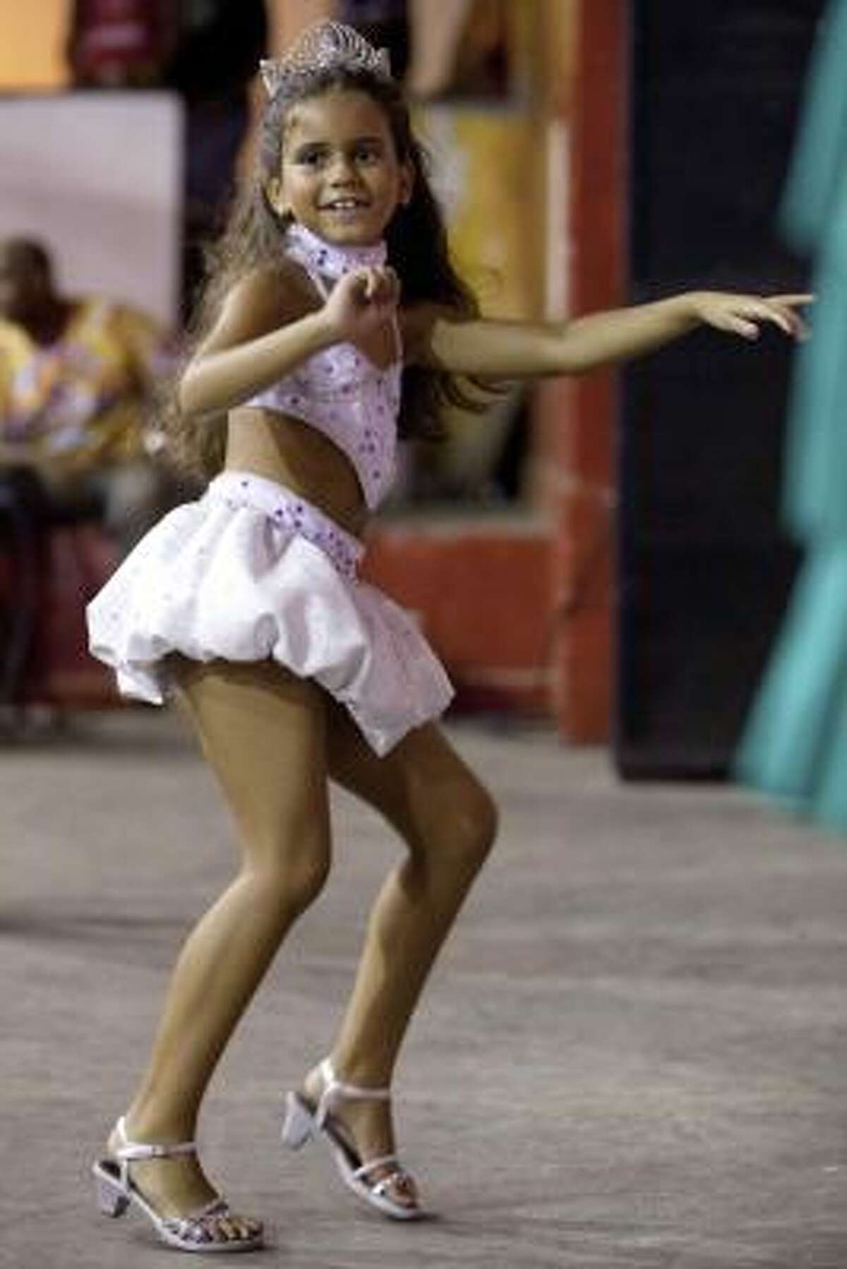 Julia Lira, 7, dances during a rehearsal by the Viradouro samba school in Rio de Janeiro late Wednesday, Feb. 3, 2010. Read the story | More world news | Chron.com