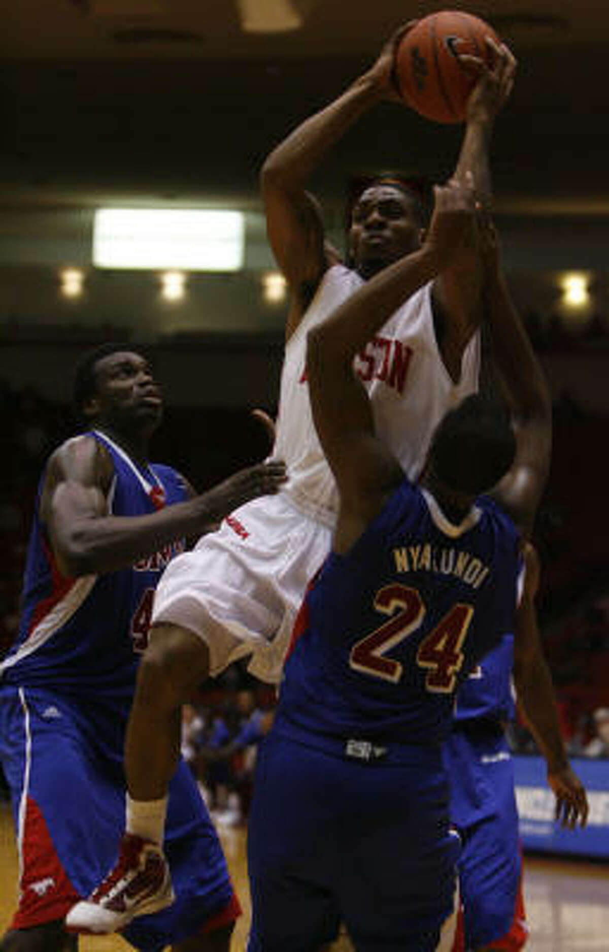 UH guard Aubrey Coleman, center, finished with 16 points and eight rebounds.