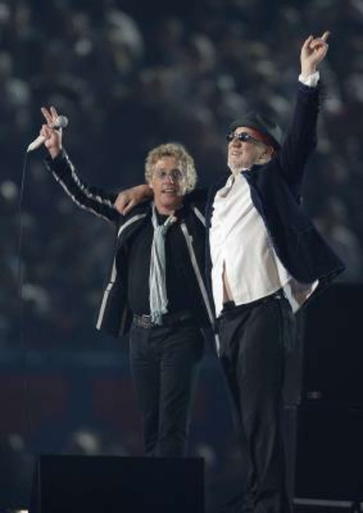 Roger Daltry, left, and Pete Townshend of The Who salute the crowd after performing during halftime of the NFL Super Bowl XLIV football game in Miami, Sunday, Feb. 7, 2010.