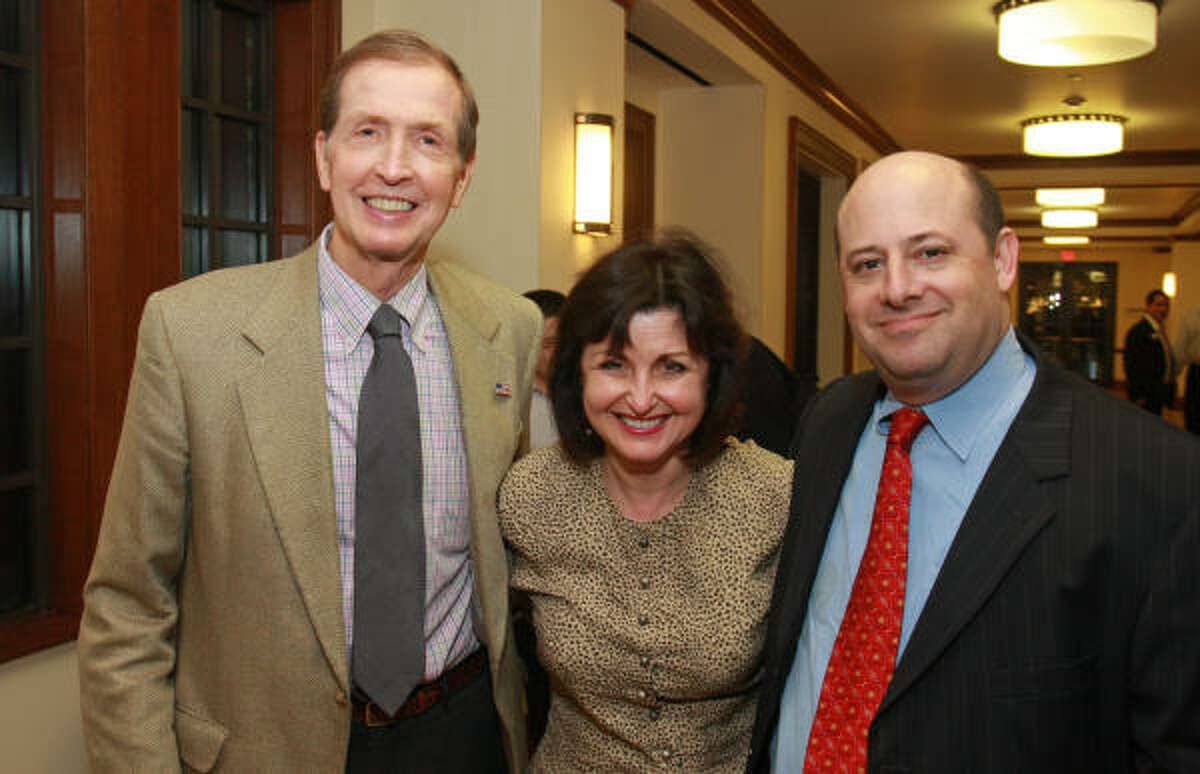 Discussion panelist John Olson, left, co-manager of Houston Energy Partners, Sue Lehrer and panelist Joel Greenberg, an Austin-based green energy and technology consultant, at the reception before the screening of "Haynesville."