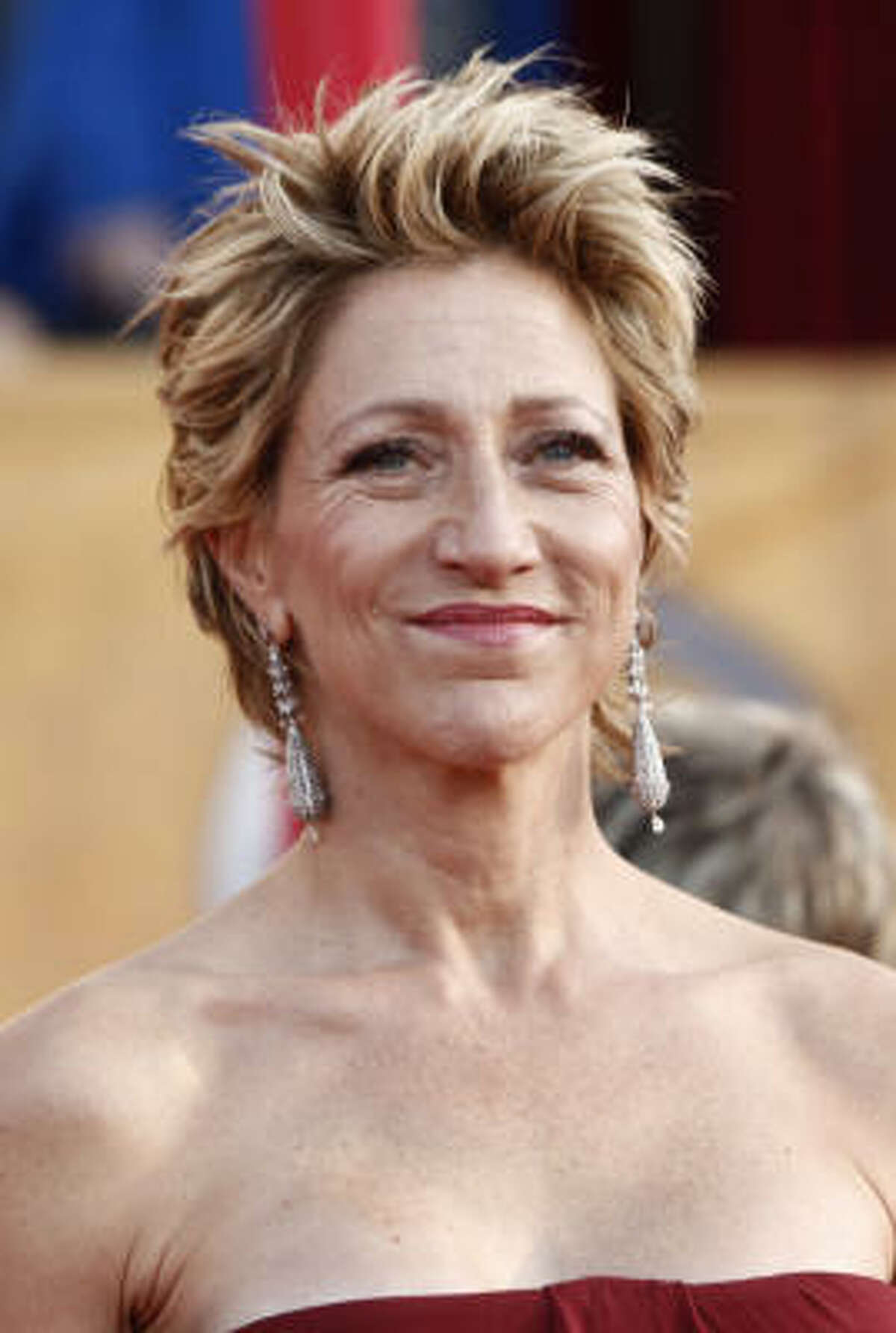 Edie Falco intros the show: "I grew up in Hawaii in a single-parent household. I struggled to succeed in a society that didn't know what to make of me, and now I'm the leader of the free world. Oh my god, that's not me. Sorry. I'm Edie Falco, and I'm an actor."