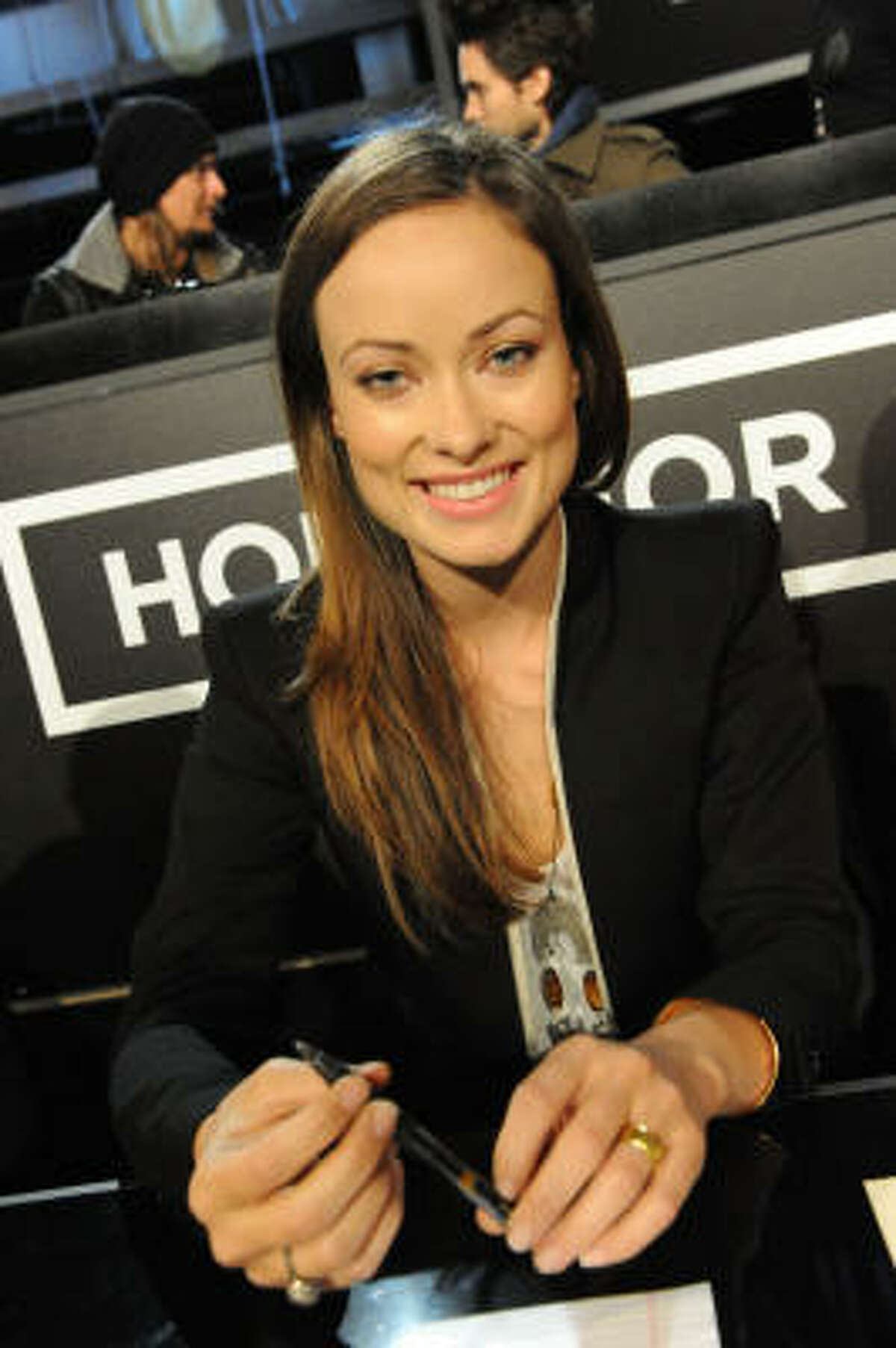 LOS ANGELES, CA - JANUARY 22: In this handout photo provided by MTV, actress Olivia Wilde waits to answer phones during the Hope For Haiti Now: A Global Benefit For Earthquake Relief telethon on January 22, 2010 in Los Angeles, California. (Photo by Jeff Kravitz/MTV Hope for Haiti Now via Getty Images)