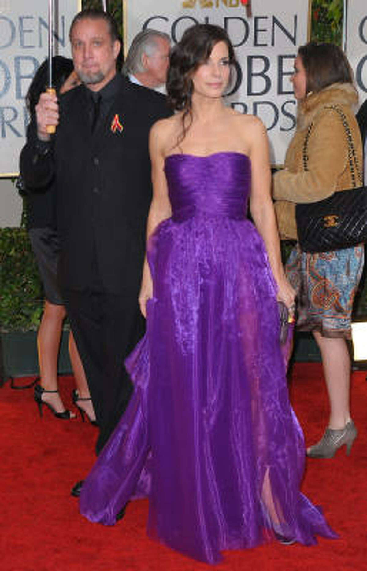 Sandra Bullock's deep-purple Bottega Veneta strapless gown had critics gushing over the color and style.