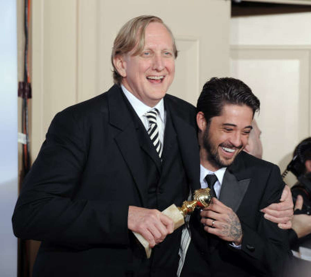 T Bone Burnett and Ryan Bingham are photographed with the award for best original song in a motion picture for Crazy Heart.