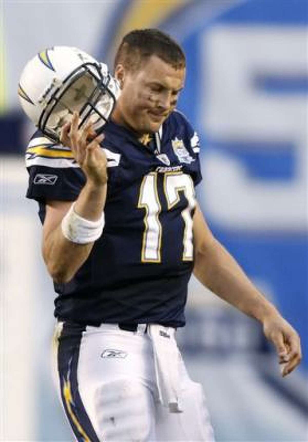 San Diego Chargers quarterback Philip Rivers walks off the field.