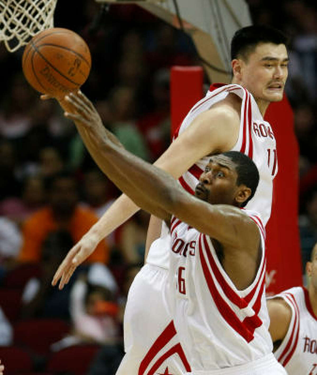 While ﻿regarded as two of the Rockets’ best players, neither Ron Artest, bottom, nor Yao Ming, top, have established themselves as the team’s singular leader.