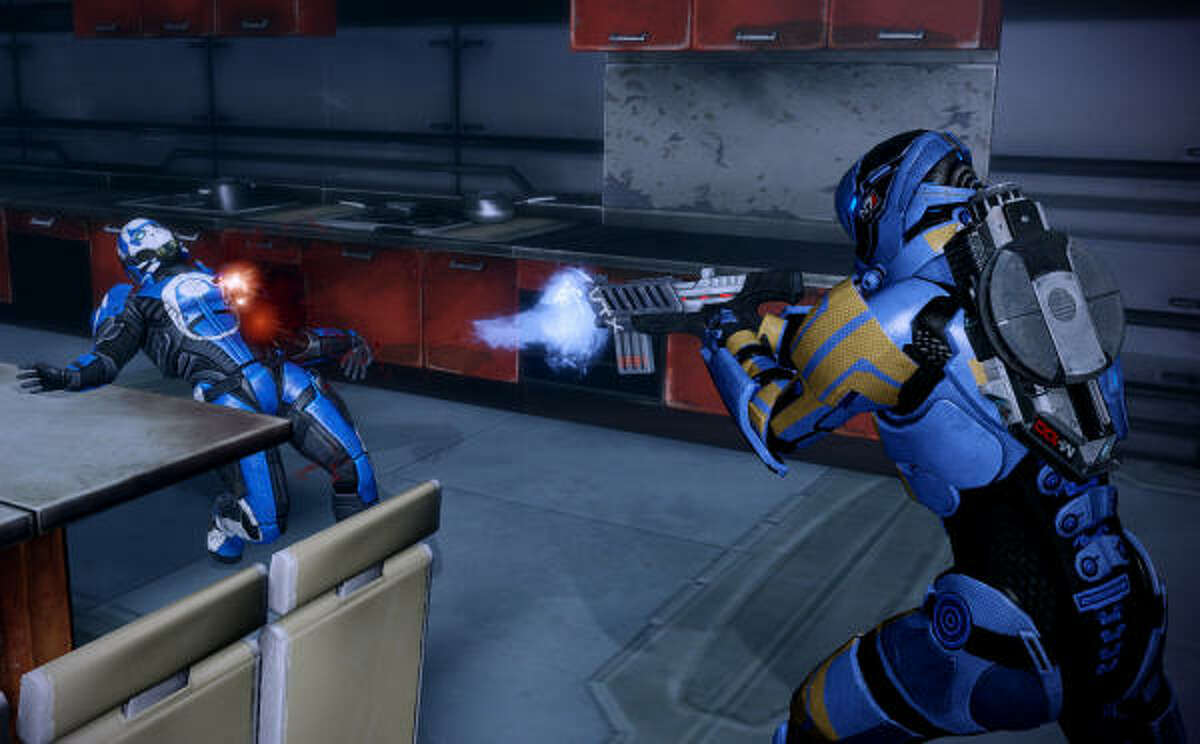 Commander Shepard, right, blasts a member of the Blue Suns faction.