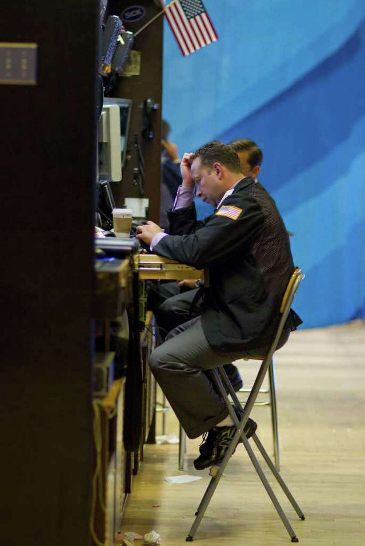 A trader works on the floor of the New York Stock Exchange on Thursday, Aug. 4, 2011 in New York.
