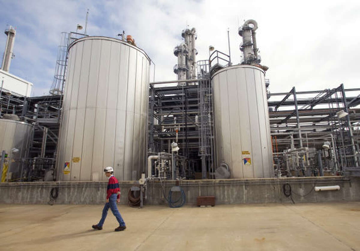 Todd Spengeman, operations manager, walks past a storage facility for intermediate product at the BASF chemical plant near Freeport in December.