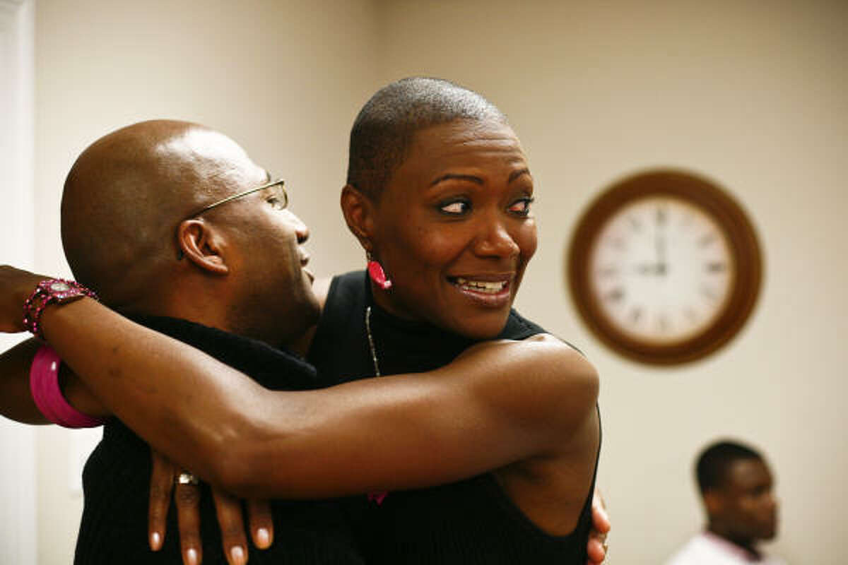 City Councilwoman Jolanda Jones hugs supporter Michael Harris while watching the election returns at her headquarters on Saturday night. She won by less than 1,700 votes.