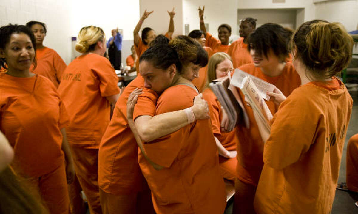 Marie Gonzalez, center, gets support from ﻿another inmate after a recent drug therapy session at the Harris County Jail.