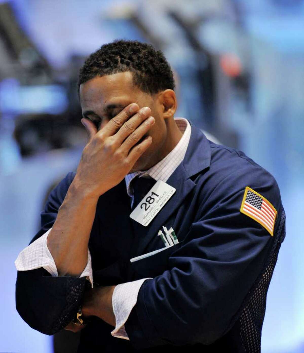 Specialist Bernard L. Wheeler of Knight Captial Americas, L.P. works on the floor of the New York Stock Exchange on August 4, 2011. The Dow Jones Industrial Average plunged 4.3 percent Thursday, its worst one-day drop in more than two years, as global markets melted down over fears of another world economic downturn. The Dow was down 512.76 points to 11,383.68; the broader S&P 500 lost 4.8 percent to 1,200.07, while the tech-heavy Nasdaq Composite plunged 5.1 percent to 2,556.39. AFP PHOTO/Stan HONDA (Photo credit should read STAN HONDA/AFP/Getty Images)