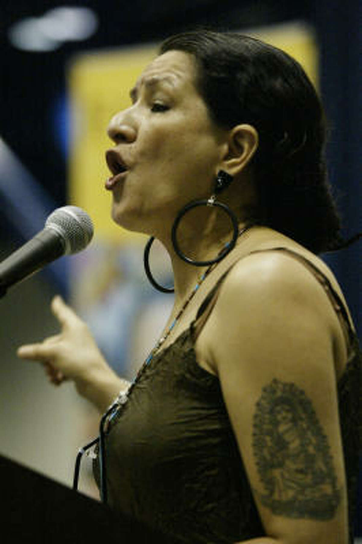Sandra Cisneros read from her works at the Houston Latino Book and Family Festival held at the Geo. R. Brown Convention Center on 10-11-03. , There were also exhibitor booths and games for children.