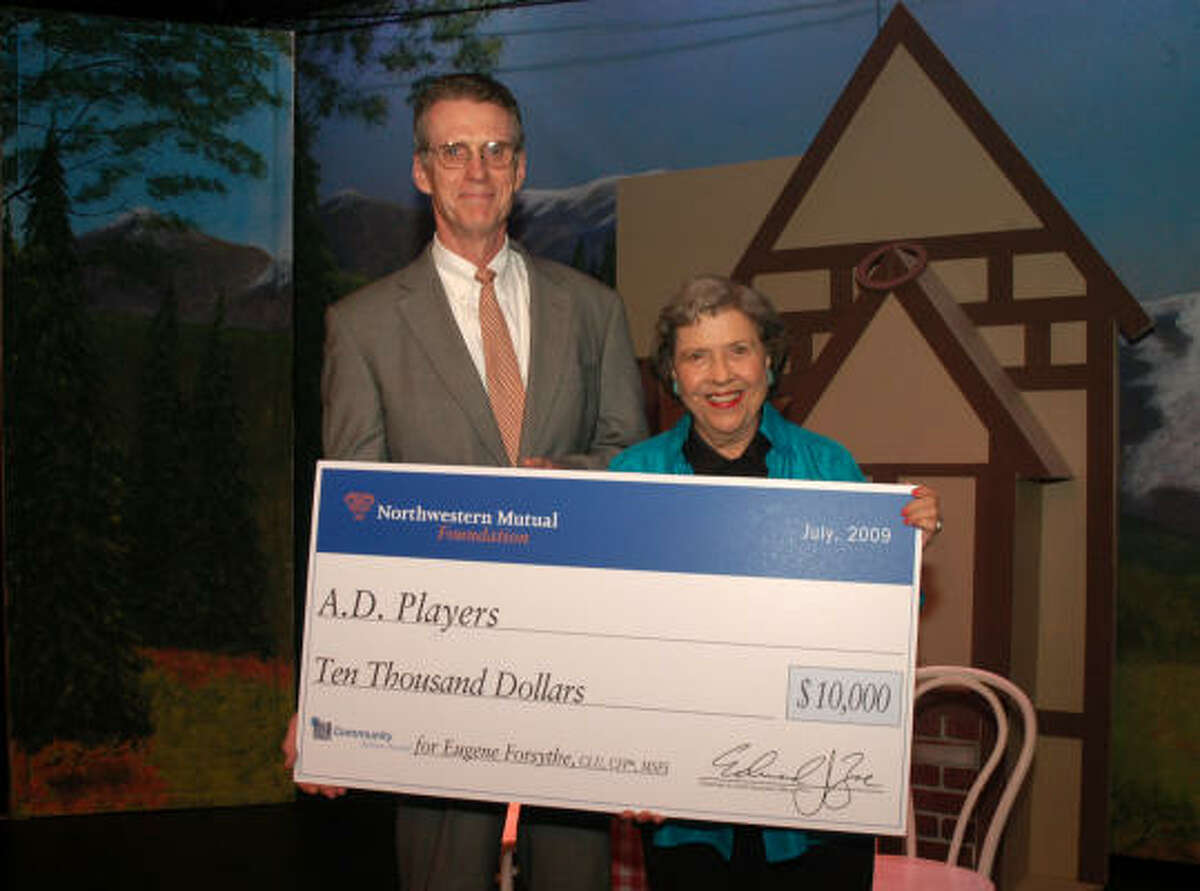 BIG CHECK: Gene Forsythe and Jeannette Clift George hold the oversized $10,000 check, donated to the A.D. Players through an Outstanding Volunteer Award Program through Forsythe?s employer, Northwestern Mutual.