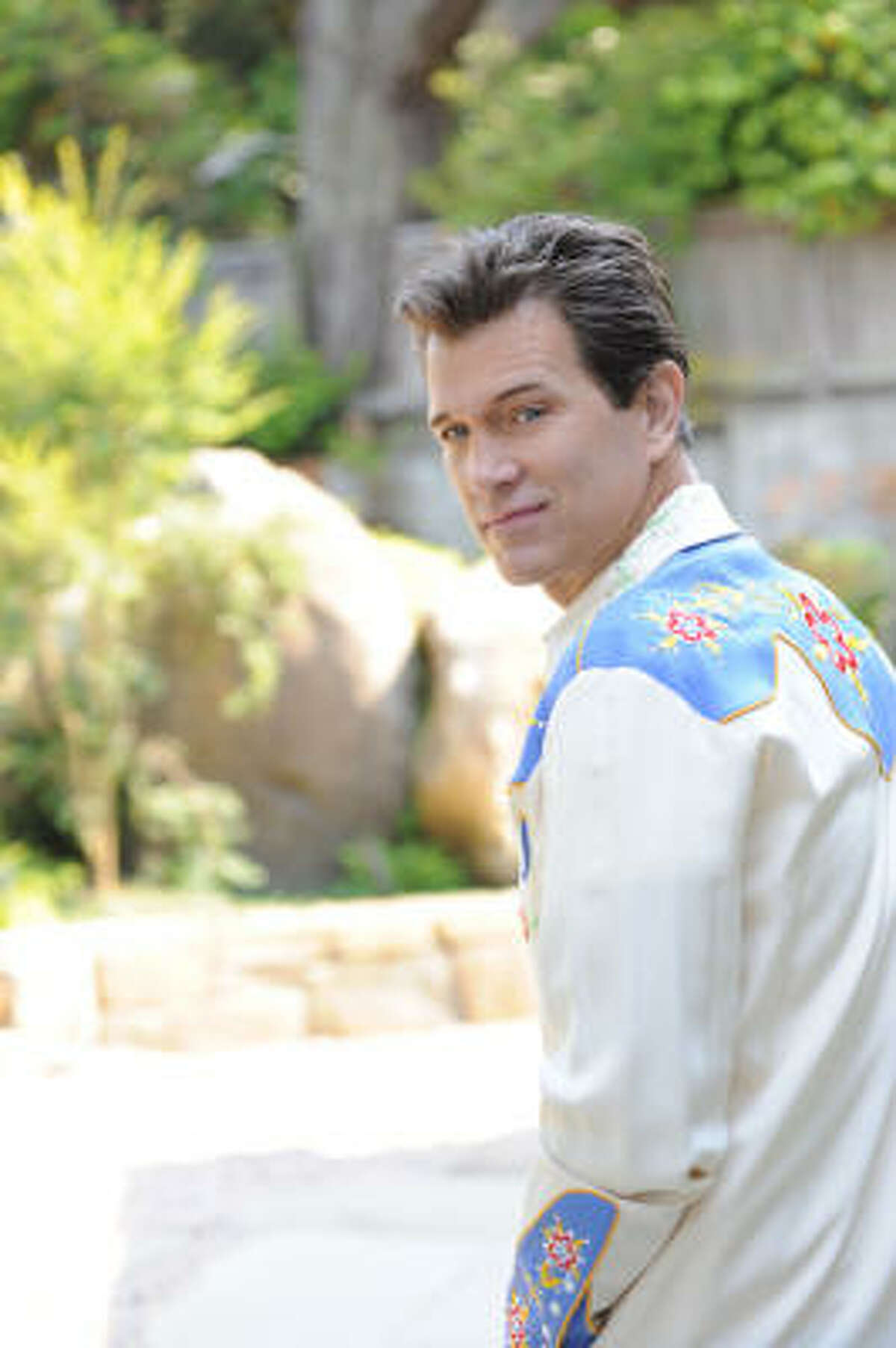Chris Isaak said he's always felt comfortable in his sparkly shirts and suits.