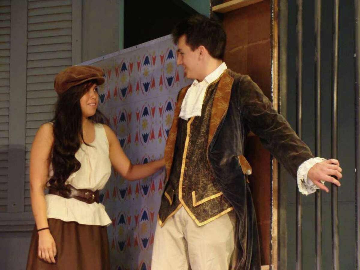 The characters of Eponine and Marius, portrayed by Kayla Shimizu, 17, and Max Rein, 18, both of Fairfield, share a moment on stage in "Les Miserables," staged this weekend and Next by the Fairfield Teen Theatre.