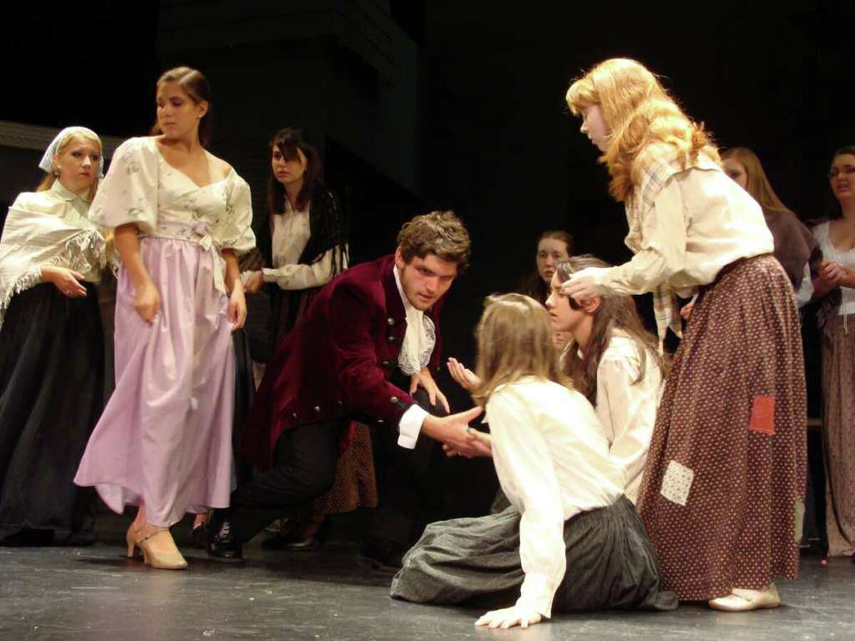 Steve Autore, center, 17, of Fairfield, is featured as Jean Valjean, one of the leads in the Fairfield Teen Theatreís production of "Les Miserables."