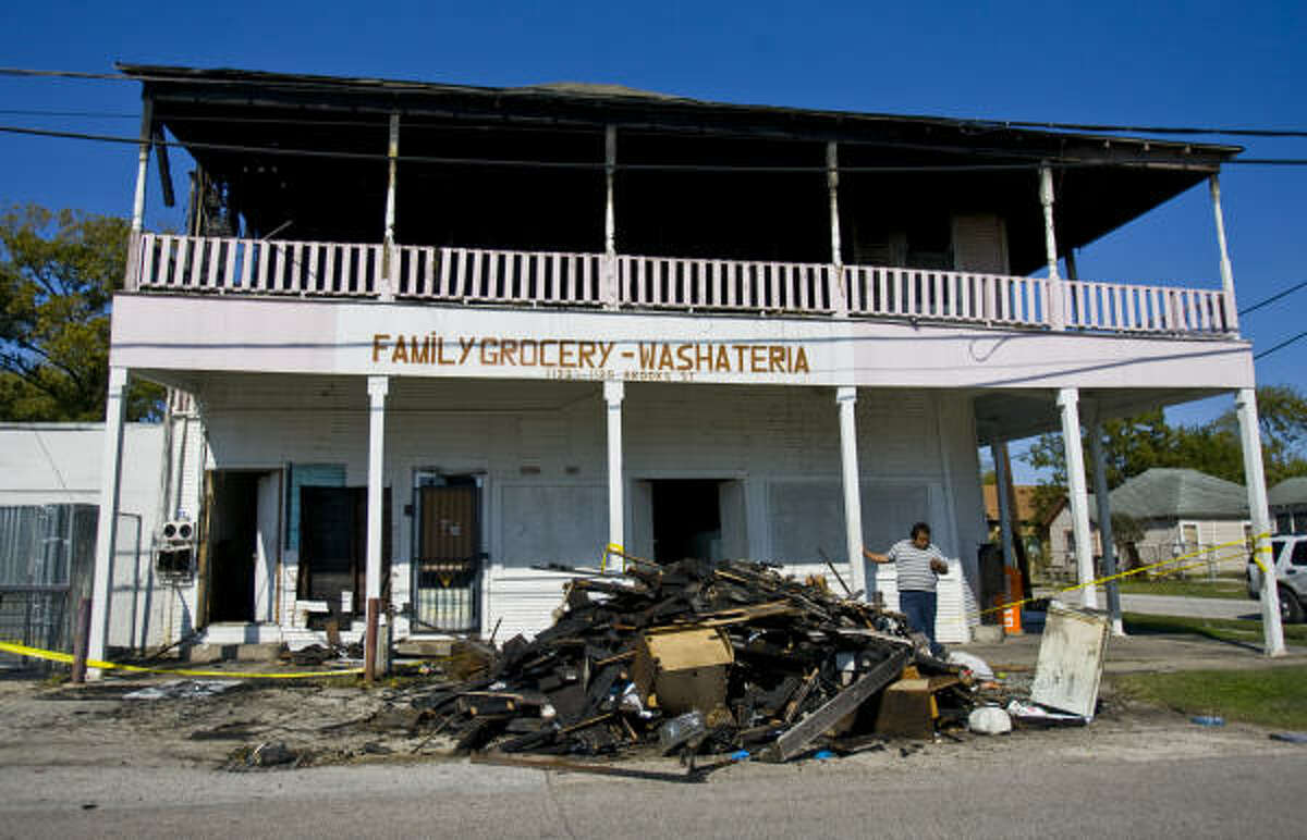 The second floor of Family Grocery-Washateria in the 1100 block of Brooks at Common in north Houston, where three people died Sunday, is a burned-out shell.﻿
