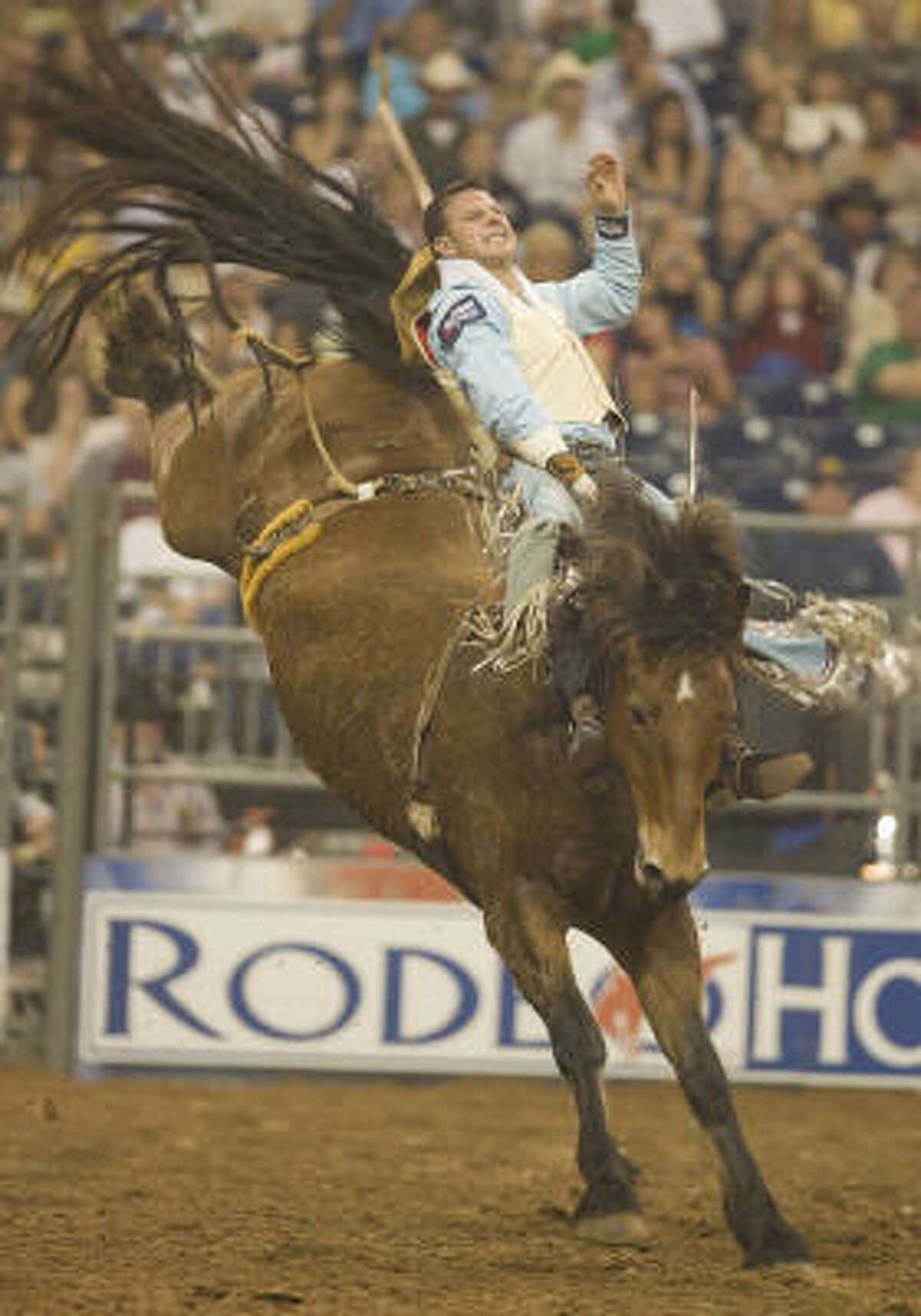 Waller’s Clint Cannon hangs on to complete his bareback ride en route to a RodeoHouston record score of 92 in Saturday’s Championship Shootout.