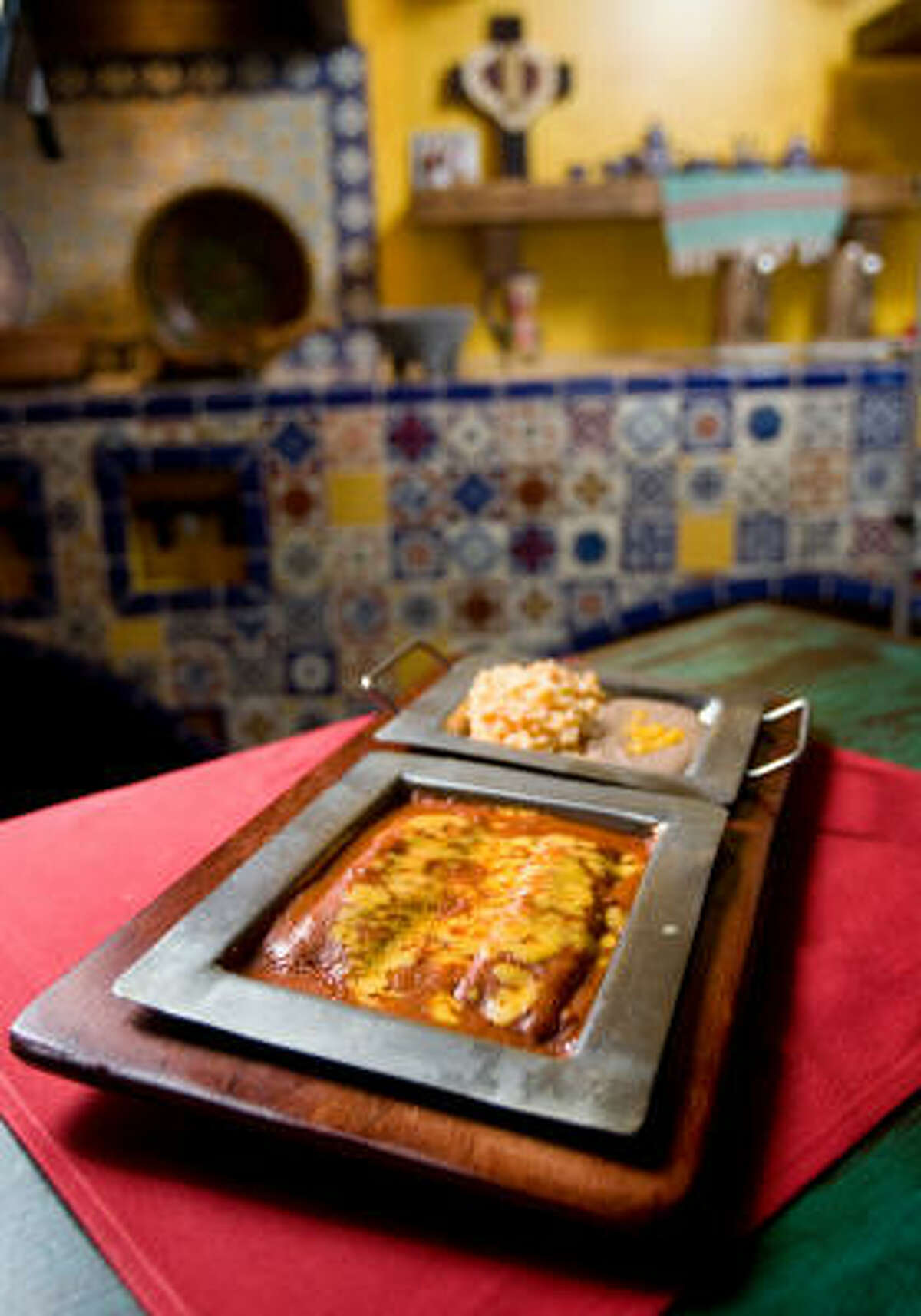 NICK de la TORRE : CHRONICLE break it up: Sylvia’s Enchiladas Refugio plate was soaked in a bricky, dusky red-chile sauce.