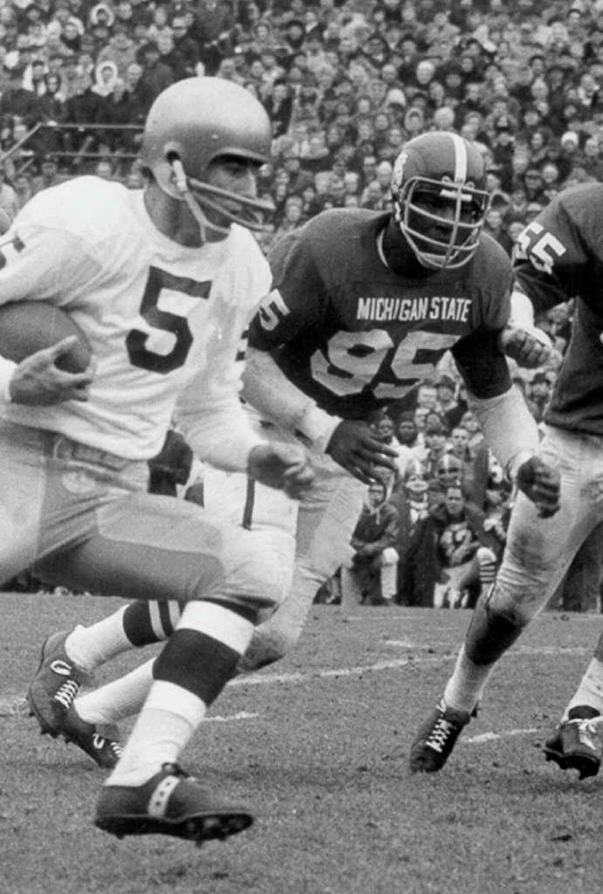 In a 1966 photo provided by Michigan State University, Michigan State's Bubba Smith, rear, chases down Notre Dame quarterback Terry Hanratty during a college football game in East Lansing, Mich. Smith, an NFL defensive star who found a successful second career as an actor, died Wednesday, Aug. 3, 2011, in Los Angeles at age 66. Los Angeles County coroner's spokesman Ed Winter said Smith was found dead at his Baldwin Hills home. Winter said he didn't know the circumstances or cause of death. (AP Photo/Michigan State University)