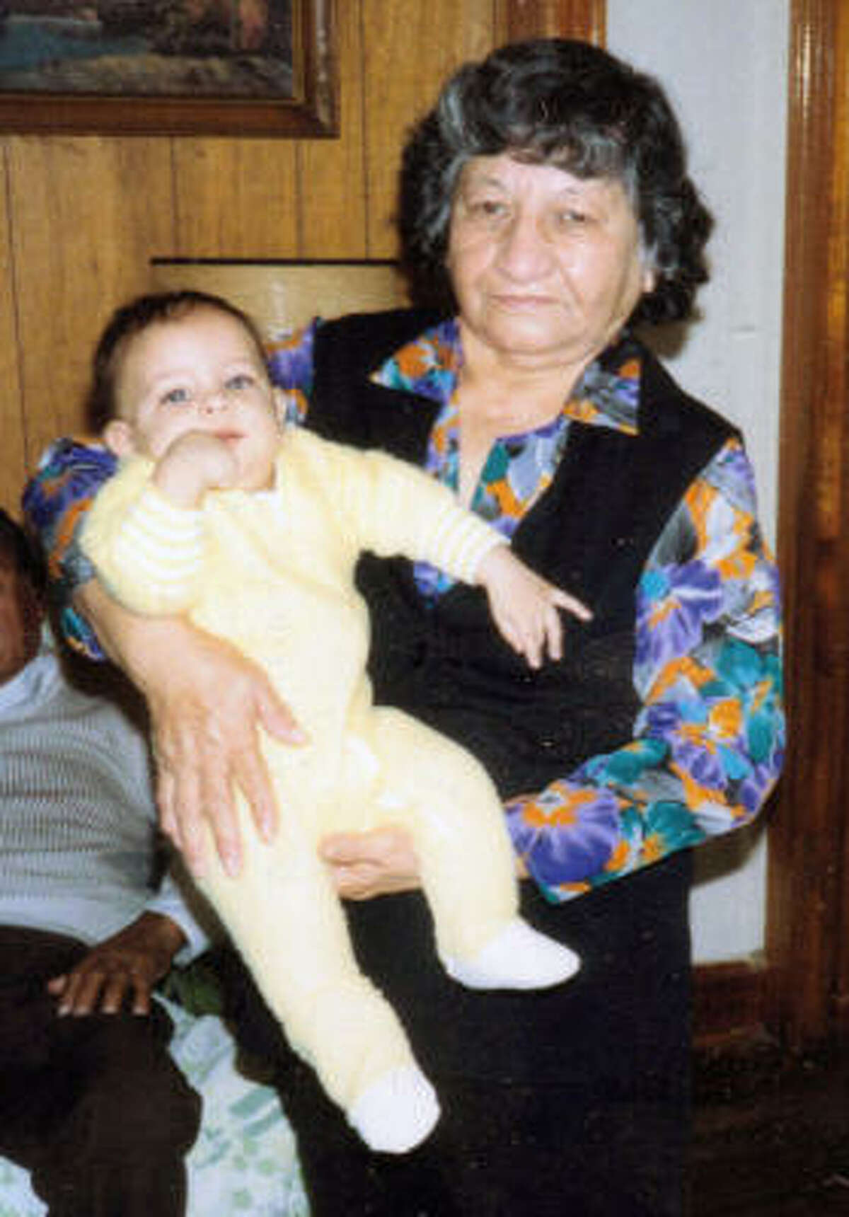 Gregoria Martinez, with one of her 300 living descendents, was a devout Catholic.