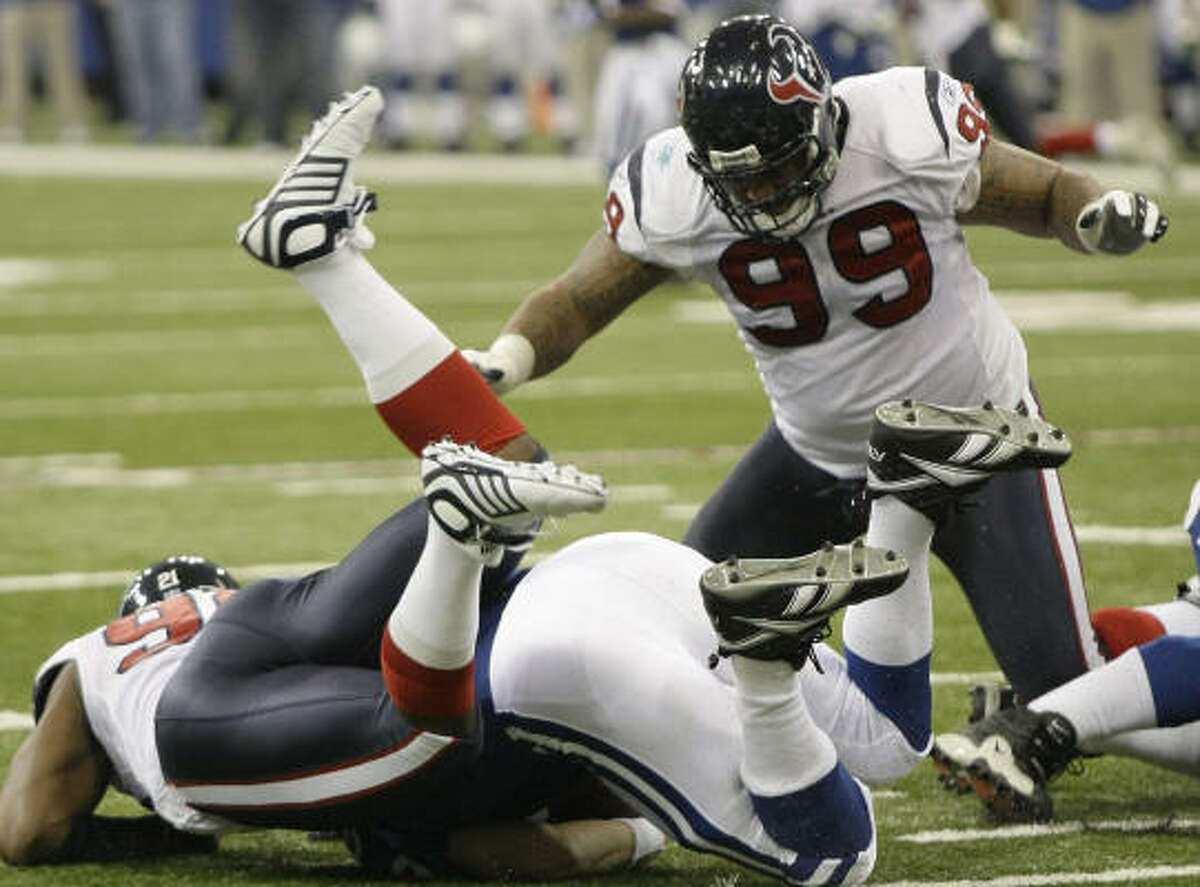 The Texans drafted defensive tackle Travis Johnson, right, in the first round in 2005.