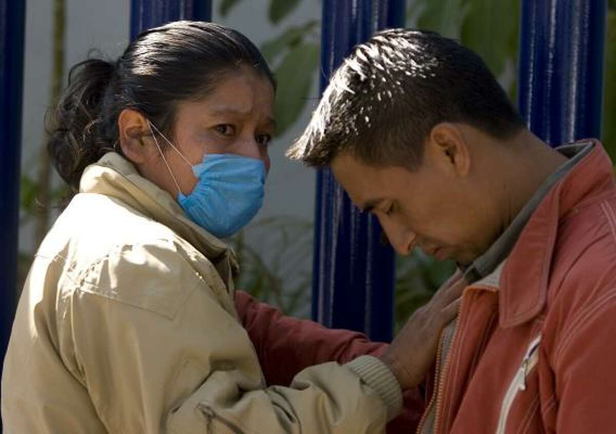 Relatives of Juana Garcia react to her death this week outside the National Institute of Respiratory Illnesses in Mexico City. According to relatives, Garcia had symptoms of the swine flu, although hospital authorities did not officially diagnose her with the disease.
