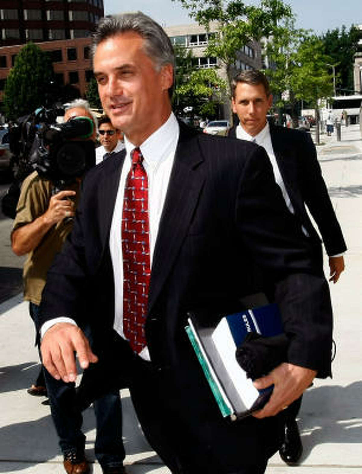 Federal prosecutor Steven Tyrrell leaves a courthouse in Richmond, Va., after R. Allen Stanford's court appearance.