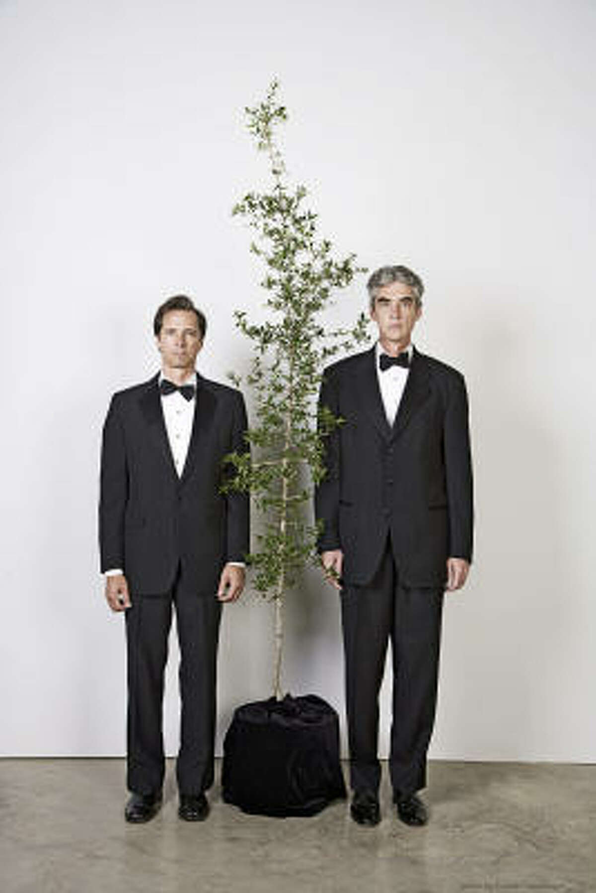 The Art Guys - Jack Massing, left, and Michael Galbreth - are staging a performance in which they marry a plant.