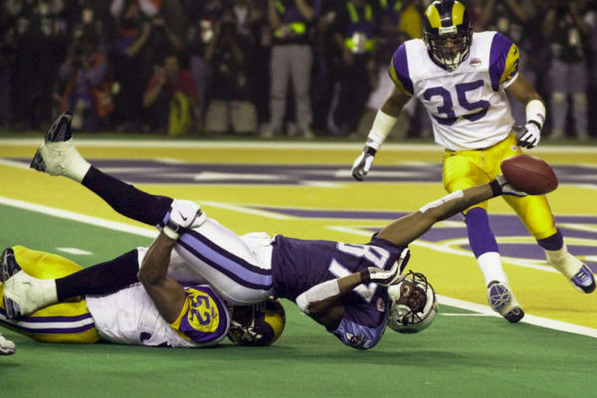 Jan. 30, 2000 | With a sure tackle in the open field, Rams linebacker Mike Jones keeps Titans wide receiver Kevin Dyson a tantalizing yard short of the end zone on the final play of the game, in the St. Louis Rams 23-16 victory over the Tennessee Titans in Super Bowl XXXIV, at the Georgia Dome in Atlanta.