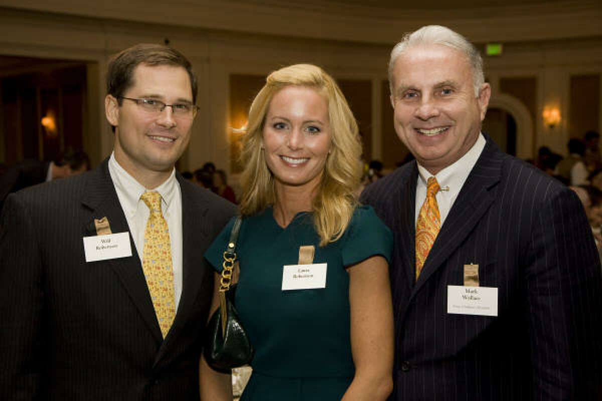 Event chair Will Robertson, Texas Children's Hospital President and CEO Mark Wallace, and event chair Laura Robertson at Texas Children's Hospital's 15th annual "What's Up, Doc?" dinner at the River Oaks Country Club, which raised $230,000 for Texas Children's Hospital Ralph D. Feigin, M.D. Endowed Fund.