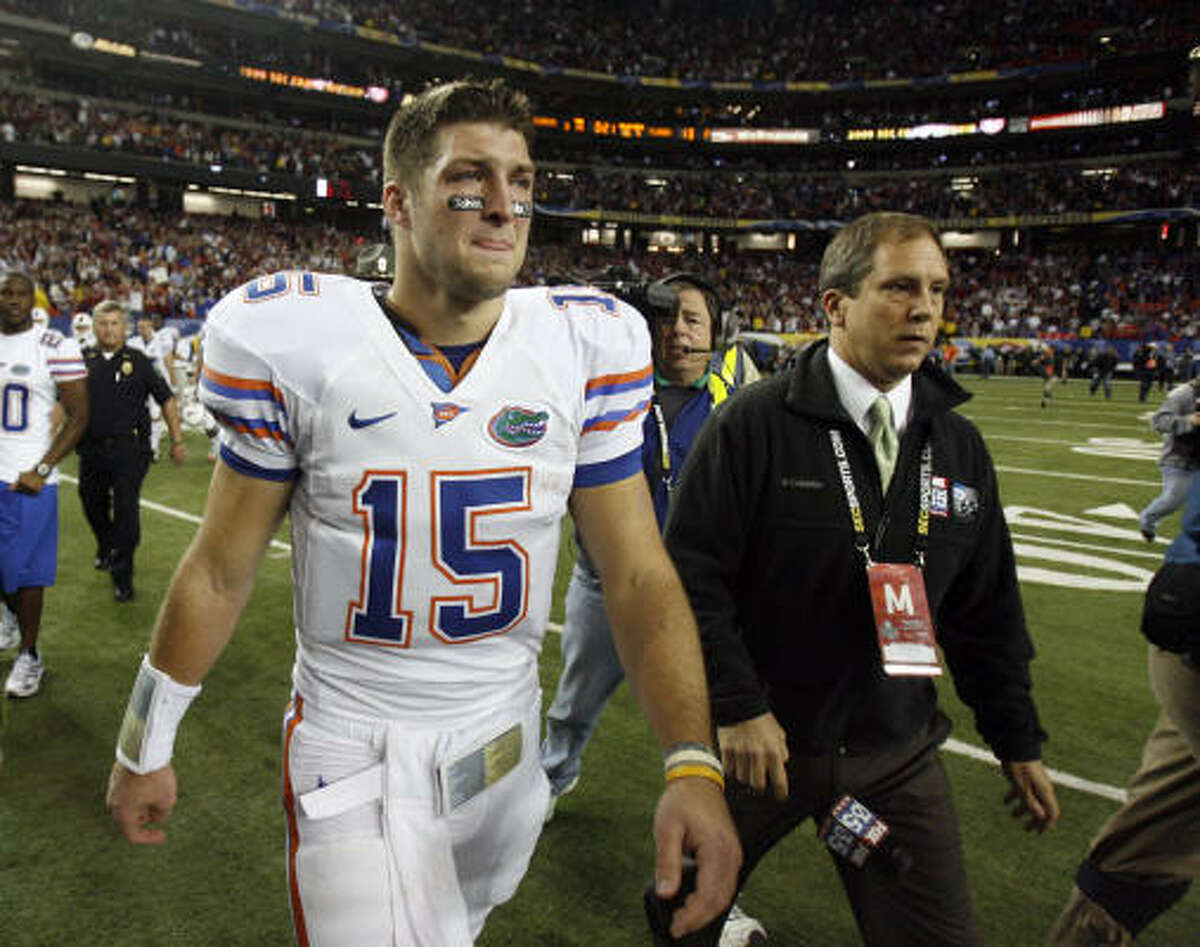 Florida quarterback Tim Tebow leaves the field after the Gators' loss.