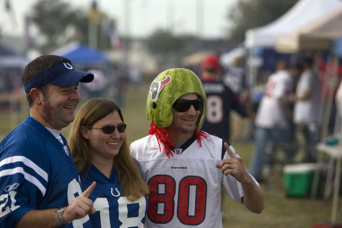 Colts fans Kim and Jason Sanders of Katy take a photo with Ryan Shead of Sugar Land.