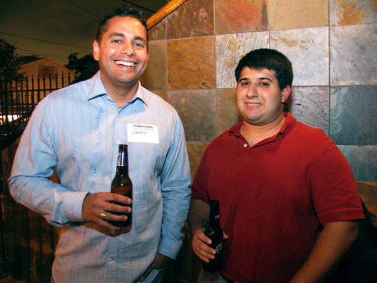 Longhorn and Aggie alum groups joined together at Ei8ht on Washington Ave. for drinks and a good time Thursday night. Pictured: Harry Torres, left, and Jason Robbins