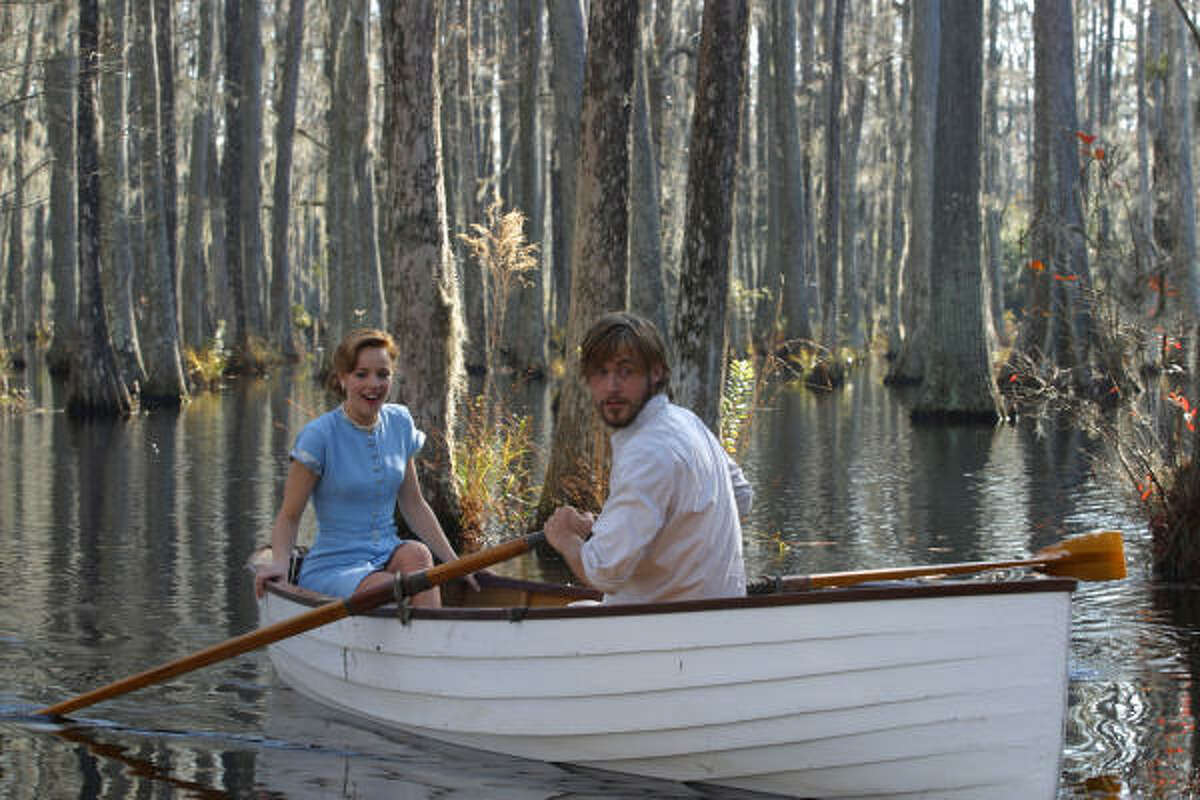 059_DF_004917 (left to right) Rachel McAdams as Allie and Ryan Gosling as Noah in New Line Cinema's romantic drama, ``The Notebook.'' Photo: © 2004 Melissa Moseley, SMPSP/New Line Productions. HOUCHRON CAPTION (06/25/2004): Love blossoms as Noah (Ryan Gosling) and Allie (Rachel McAdams) take a romantic boat ride in ``The Notebook.''