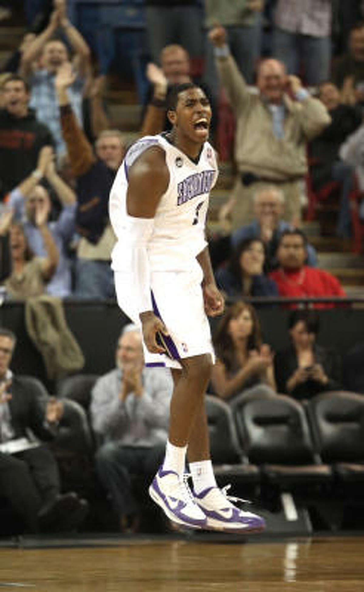 Kings forward Jason Thompson celebrates in the final moments of the fourth quarter.