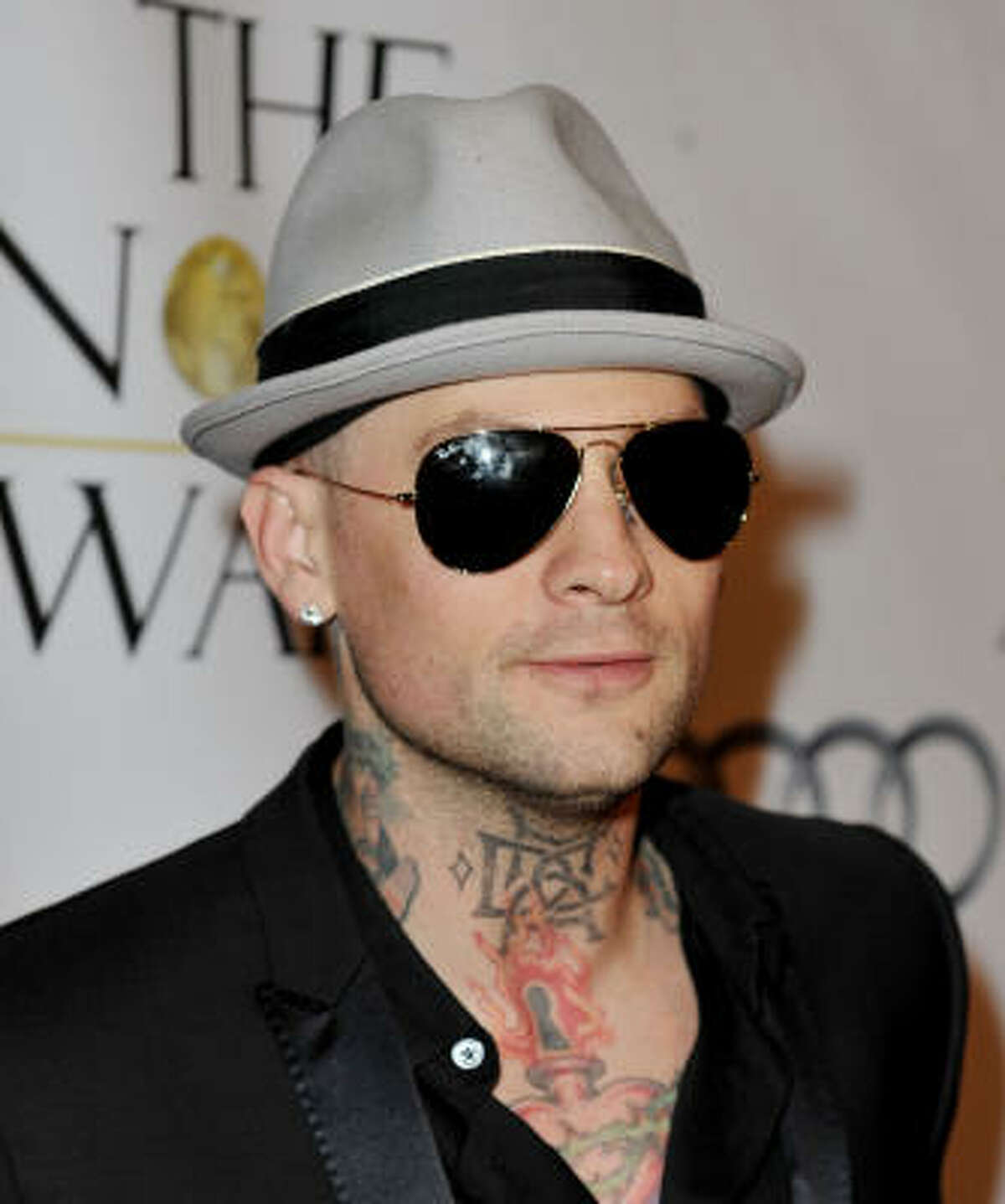 Benji Madden of Good Charlotte and Paris Hilton dating fame has multiple neck tattoos.