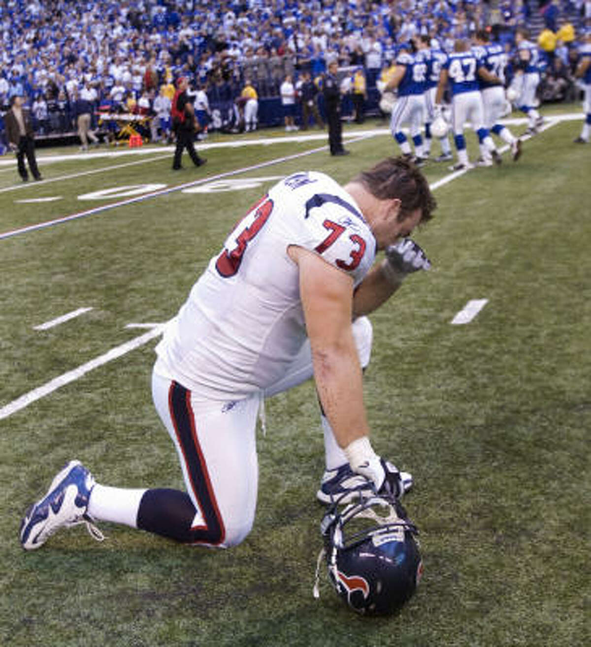 Texans offensive tackle Eric Winston kneels on the field after kicker Kris Brown missed a 42-yard field goal as time expired.