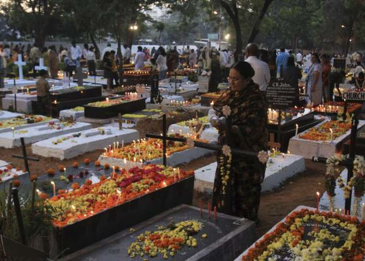 Christians decorate the graves of their relatives with flowers and candles on All Souls' Day in Hyderabad, India.